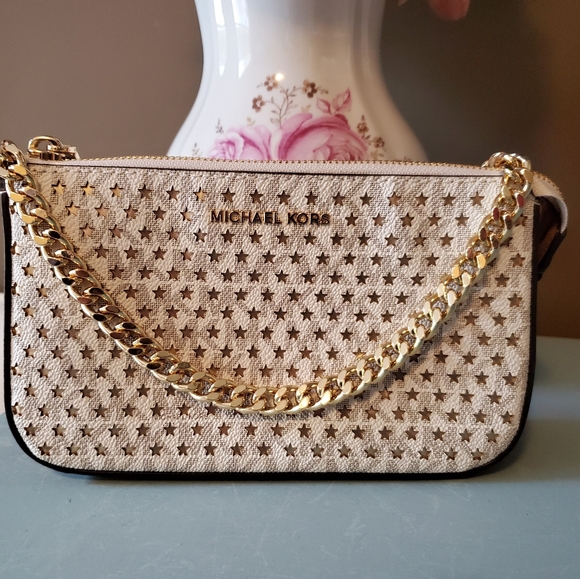 Michael Kors Handbags - NWOT Michael Kors Perforated Gold Star Purse